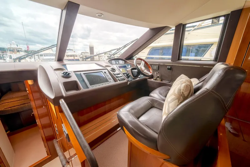 Slide: The Image of Luxurious helm of 2012 Princess Flybridge 60 Motor Yacht with leather seating. - 30