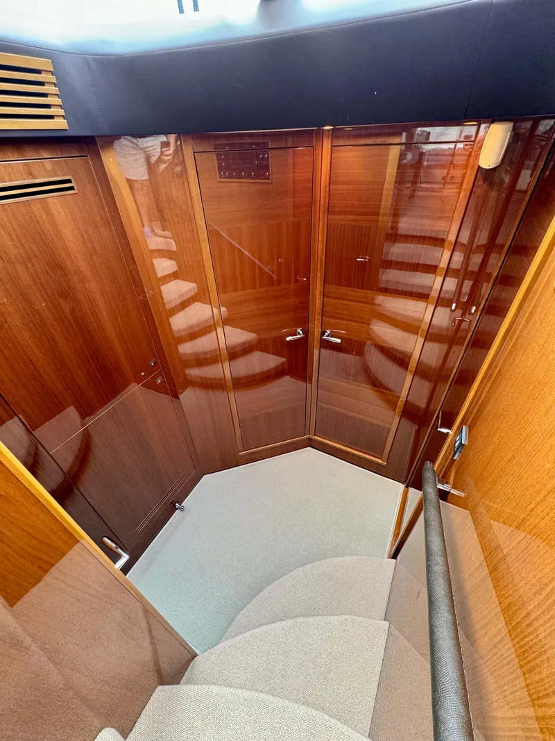 Slide: The Image of Luxurious wood interior of 2012 Princess Flybridge 60 Motor Yacht staircase. - 34