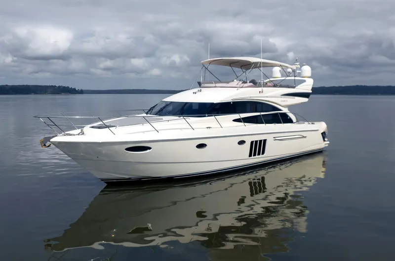 Slide: The Image of 2012 Princess Flybridge 60 Motor Yacht on calm water. - 4