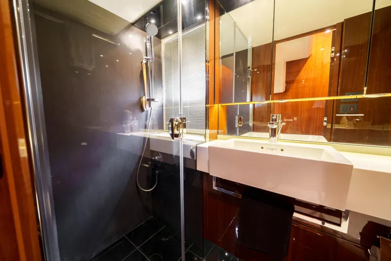 Slide: The Image of Luxurious bathroom in 2012 Princess Flybridge 60 Motor Yacht with modern fixtures and sleek design. - 41