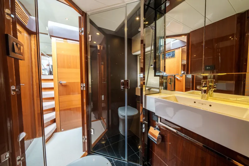 Slide: The Image of Luxurious bathroom in 2012 Princess Flybridge 60 Motor Yacht with modern fixtures and wood accents. - 46
