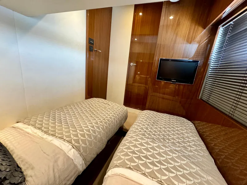 Slide: The Image of Luxurious twin cabin in 2012 Princess Flybridge 60 Motor Yacht with TV and elegant decor. - 49