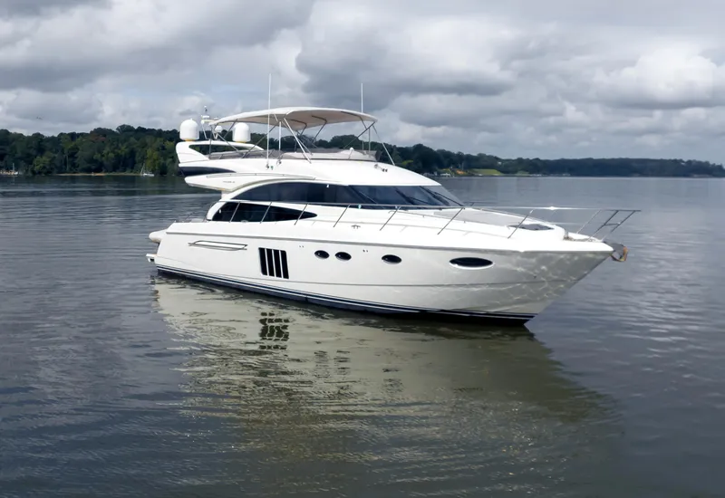 Slide: The Image of 2012 Princess Flybridge 60 Motor Yacht on calm water, overcast sky. - 7