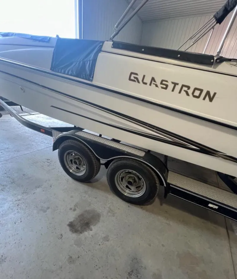 Slide: The Image of 2004 Glastron DX 215 boat on trailer in garage. - 3
