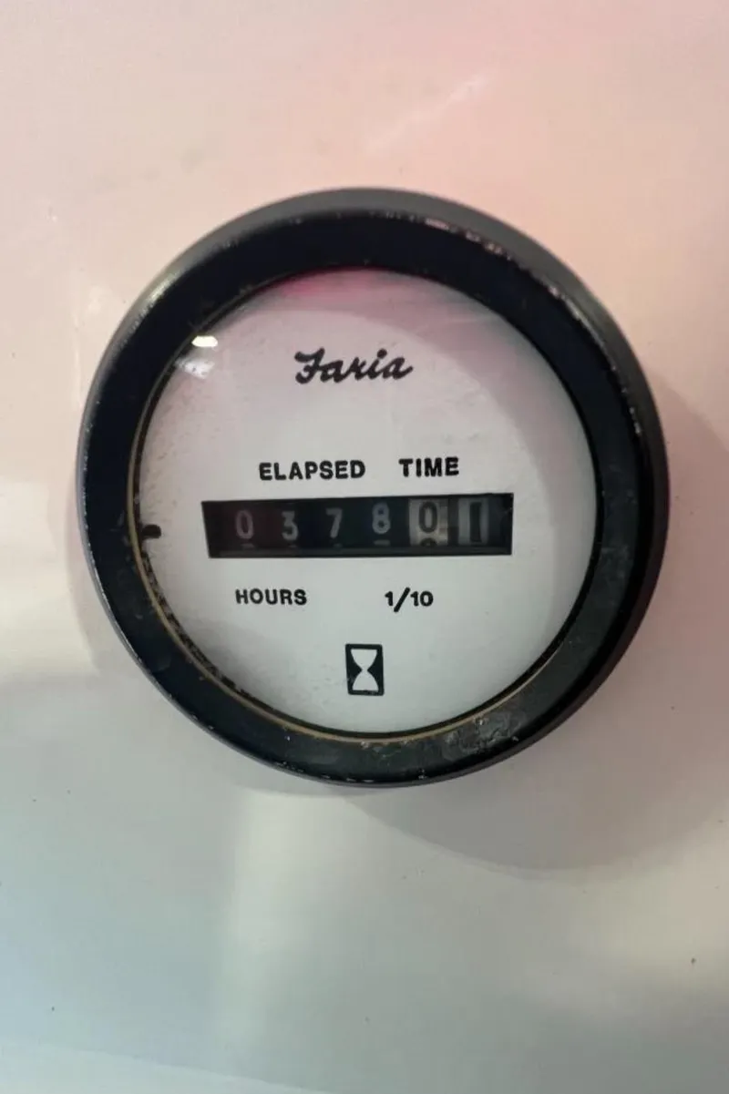 Slide: The Image of Faria elapsed time gauge showing 378 hours on 2004 Glastron DX 215 boat. - 4