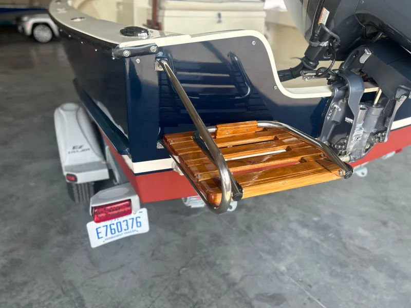 Slide: The Image of 2012 Seaway 18 Sportsman boat with wooden swim platform and outboard motor. - 12