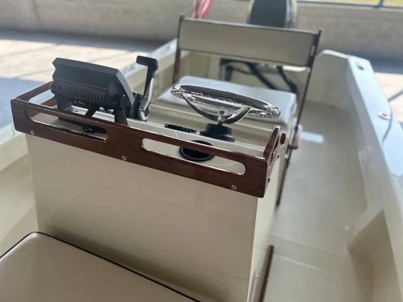 Slide: The Image of 2012 Seaway 18 Sportsman boat interior with steering wheel and controls. - 14