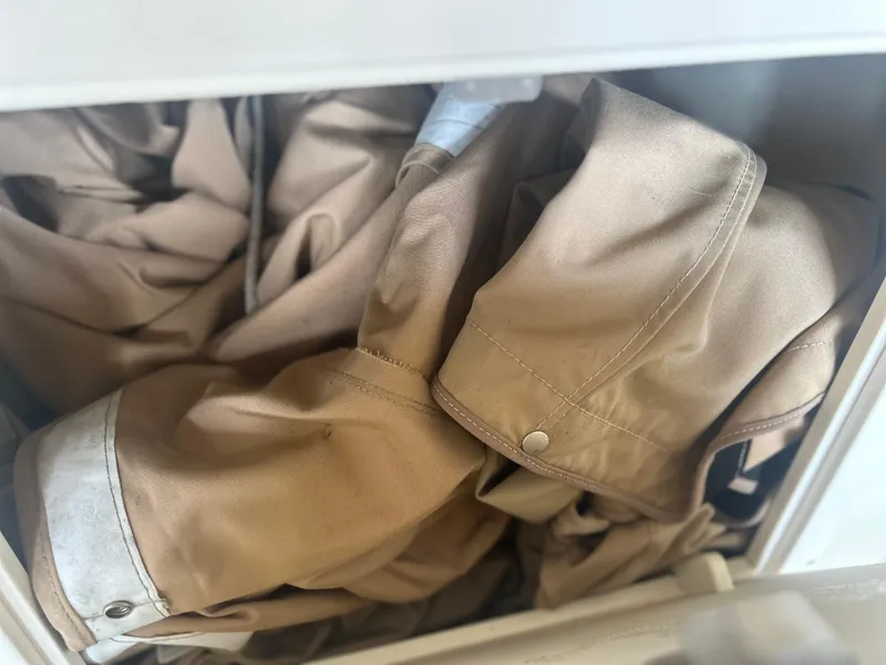 Slide: The Image of Beige fabric stored in a drawer, possibly clothing or canvas material. - 16