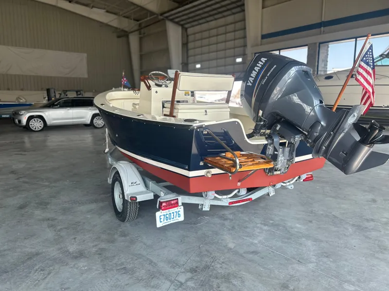 Slide: The Image of 2012 Seaway 18 Sportsman boat with Yamaha motor in a garage setting. - 2