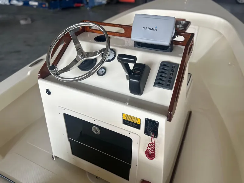 Slide: The Image of 2012 Seaway 18 Sportsman boat console with Garmin GPS and steering wheel. - 4