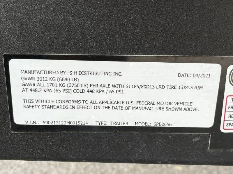 Slide: The Image of Label on a 2021 Premier 250 Grand Majestic trailer, detailing weight and safety specifications. - 15