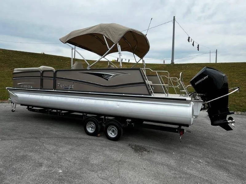 Slide: The Image of 2021 Premier 250 Grand Majestic pontoon boat on trailer with Mercury outboard motor. - 17