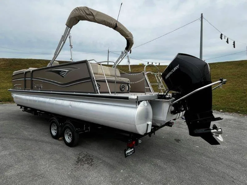 Slide: The Image of 2021 Premier 250 Grand Majestic pontoon boat with Mercury outboard motor on trailer. - 27