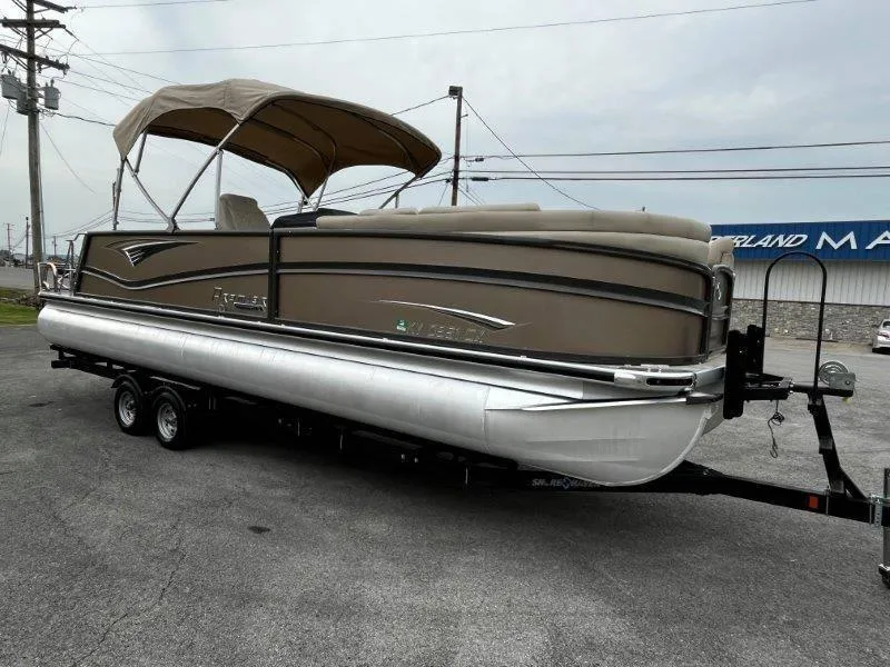 Slide: The Image of 2021 Premier 250 Grand Majestic pontoon boat on trailer, beige with canopy. - 30