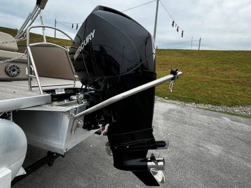 Slide: The Image of 2021 Premier 250 Grand Majestic with Mercury outboard motor on a trailer. - 32