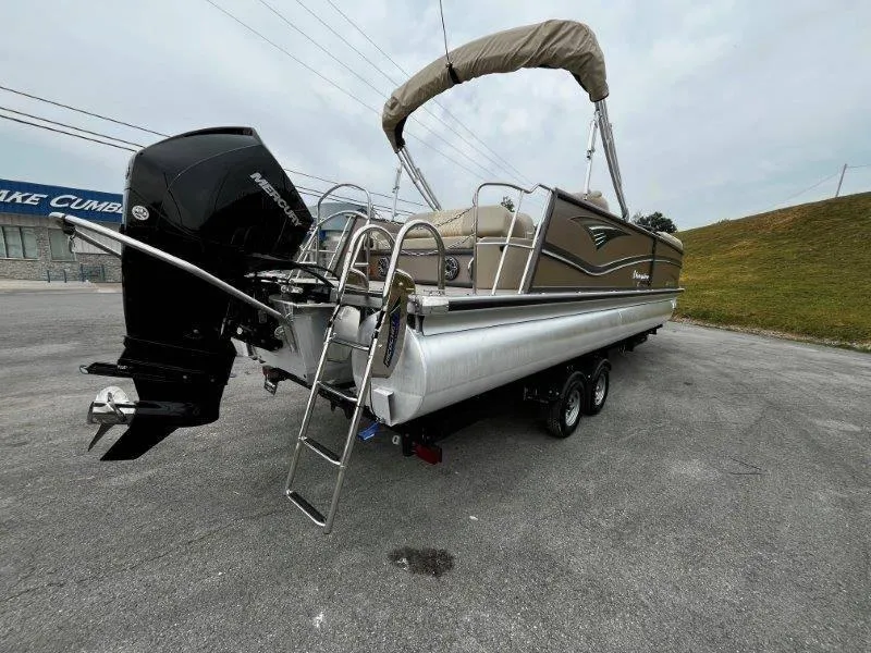 Slide: The Image of 2021 Premier 250 Grand Majestic pontoon boat on trailer, featuring Mercury outboard motor. - 33