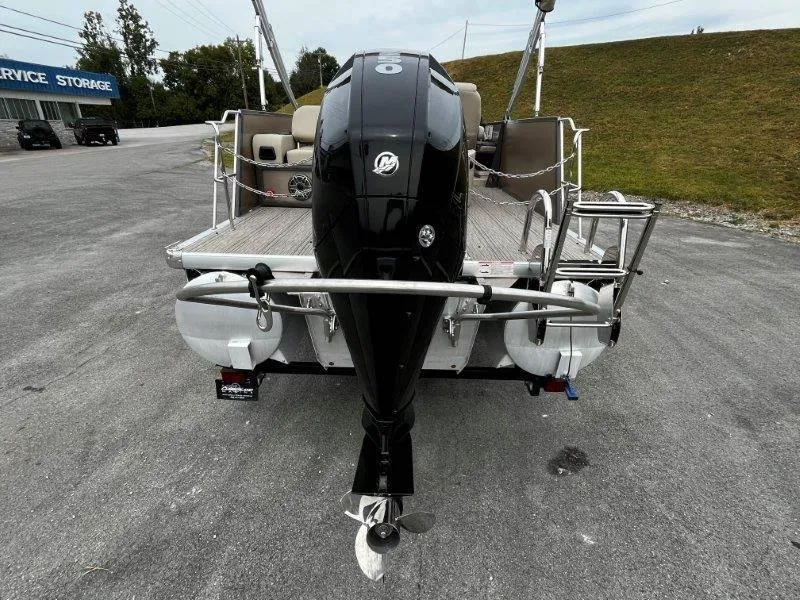 Slide: The Image of 2021 Premier 250 Grand Majestic pontoon boat with powerful outboard motor. - 34