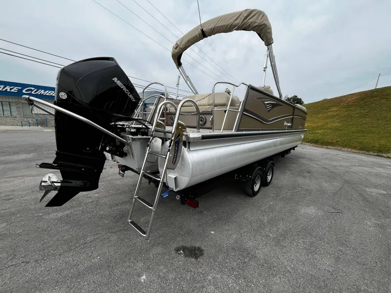 Slide: The Image of 2021 Premier 250 Grand Majestic pontoon boat on trailer, featuring Mercury outboard motor. - 44