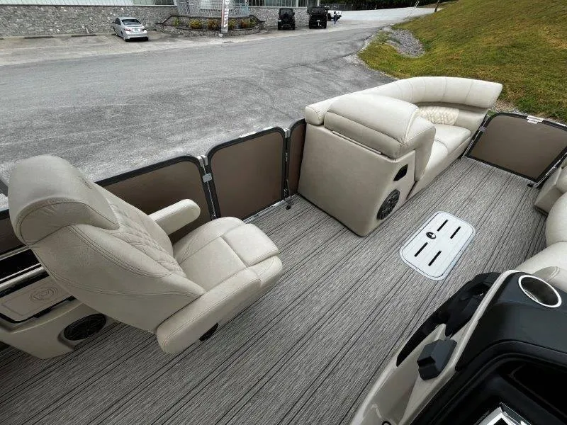 Slide: The Image of 2021 Premier 250 Grand Majestic boat interior with plush seating and sleek flooring. - 45