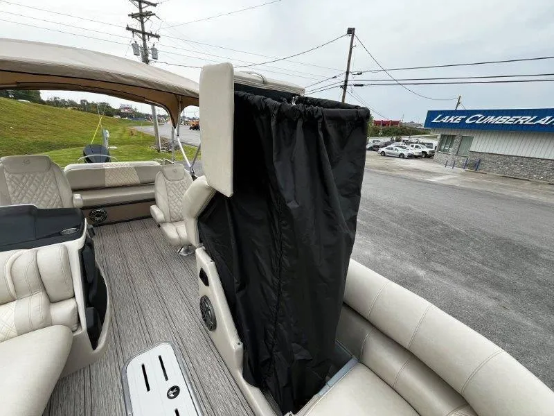 Slide: The Image of 2021 Premier 250 Grand Majestic boat interior with seating and privacy curtain. - 46