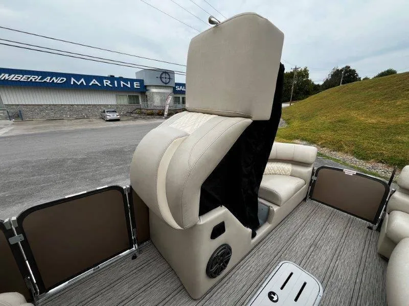 Slide: The Image of 2021 Premier 250 Grand Majestic boat interior with beige seating and speaker system. - 49