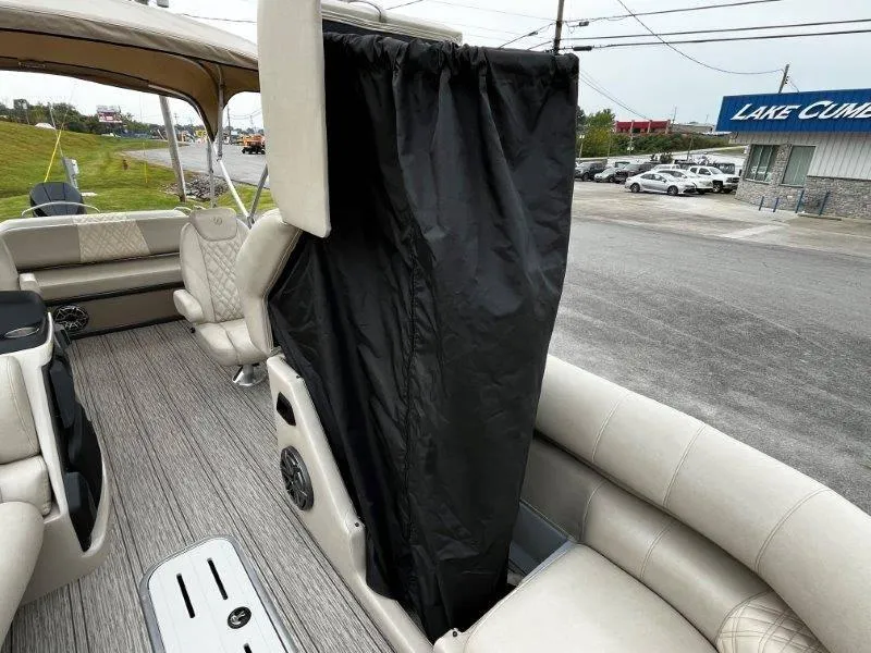 Slide: The Image of 2021 Premier 250 Grand Majestic boat interior with privacy curtain and seating. - 51