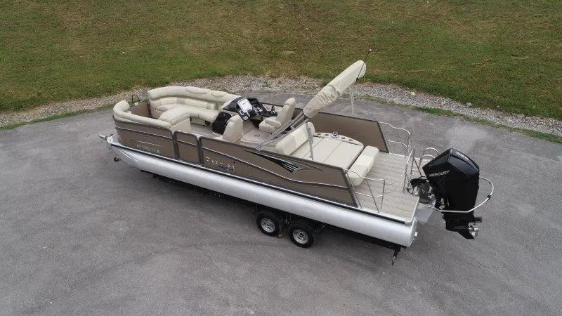Slide: The Image of 2021 Premier 250 Grand Majestic pontoon boat on trailer, beige seating, outboard motor. - 6