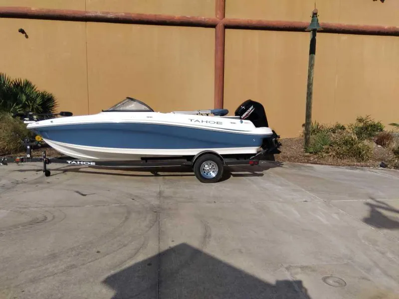 Slide: The Image of 2024 Tahoe 200 S boat on trailer, parked outdoors. - 0