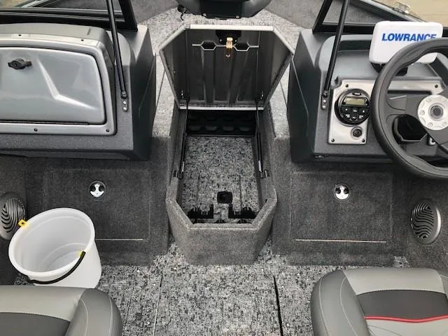 Slide: The Image of 2025 Tracker Pro Guide V-175 Combo boat interior with steering wheel and storage compartments. - 10