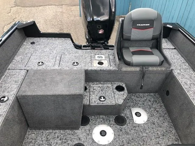 Slide: The Image of 2025 Tracker Pro Guide V-175 Combo boat interior with seating and storage compartments. - 20
