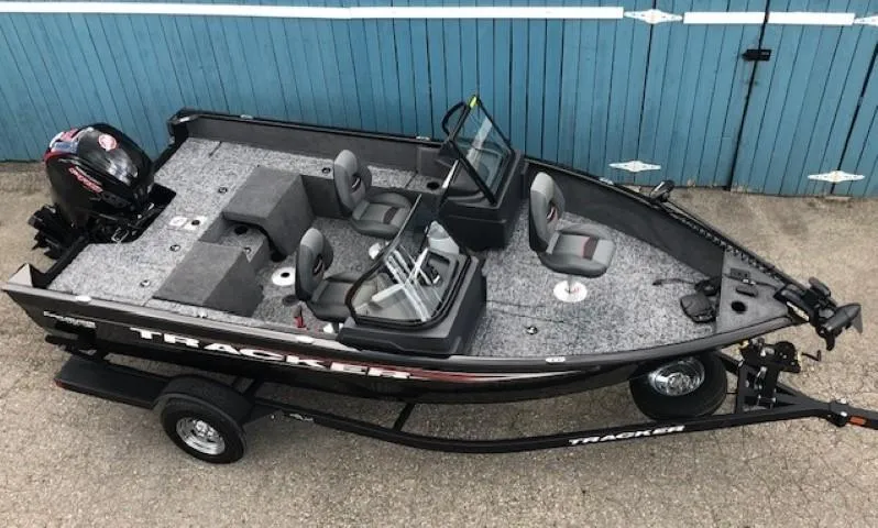 Slide: The Image of 2025 Tracker Pro Guide V-175 Combo boat on trailer, blue background. - 4