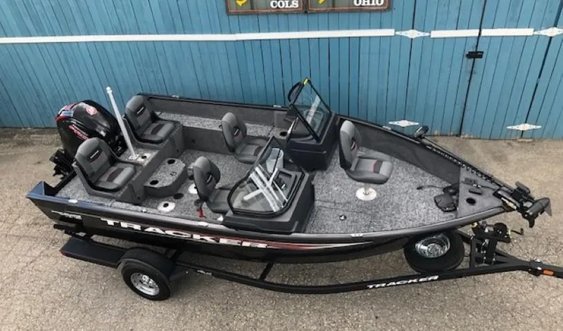 Slide: The Image of 2025 Tracker Pro Guide V-175 Combo fishing boat on trailer, blue background. - 5
