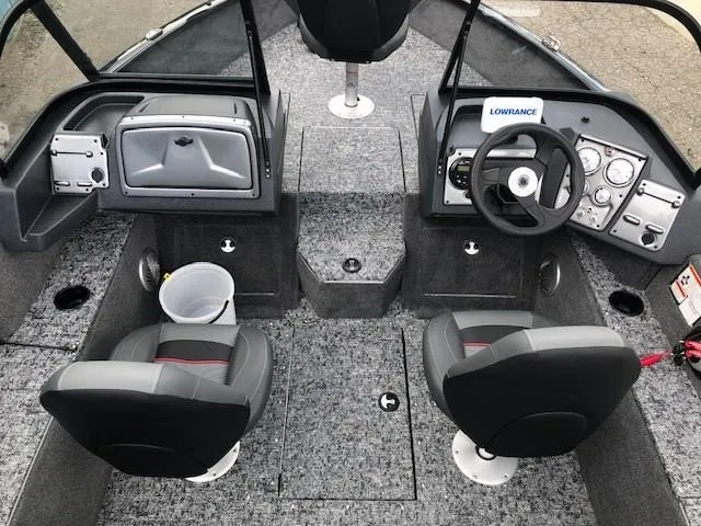 Slide: The Image of 2025 Tracker Pro Guide V-175 Combo boat interior with dual seats and steering console. - 9