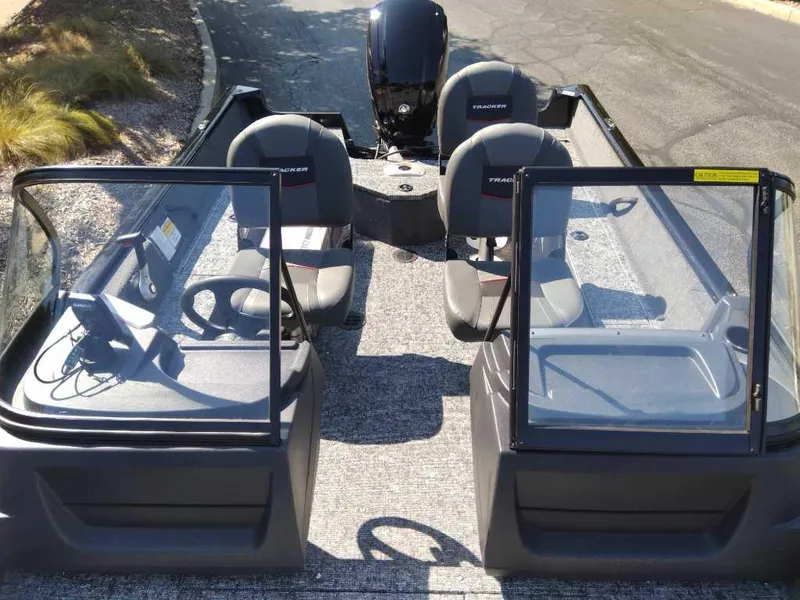Slide: The Image of 2025 Tracker Pro Guide V-16 WT boat interior with dual seating and windshield. - 3