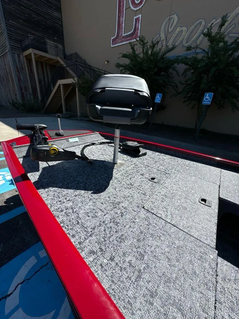 Slide: The Image of 2025 Tracker Pro 170 boat deck with mounted seat and fishing equipment. - 4