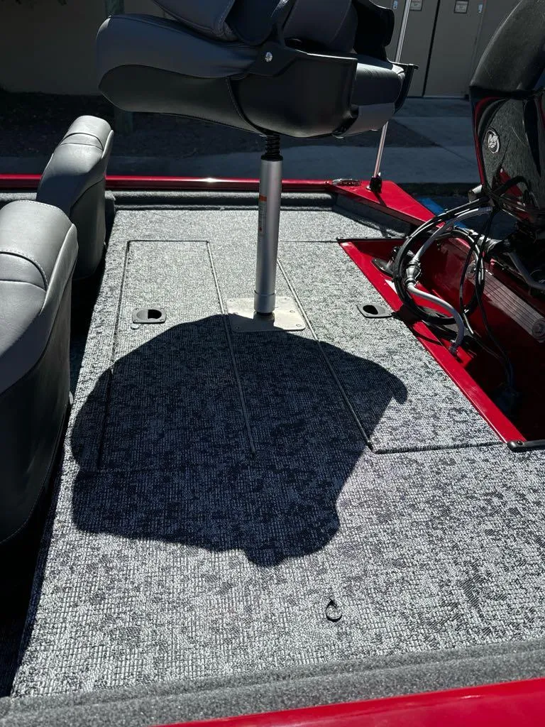 Slide: The Image of 2025 Tracker Pro 170 boat interior with gray carpet and seating. - 6