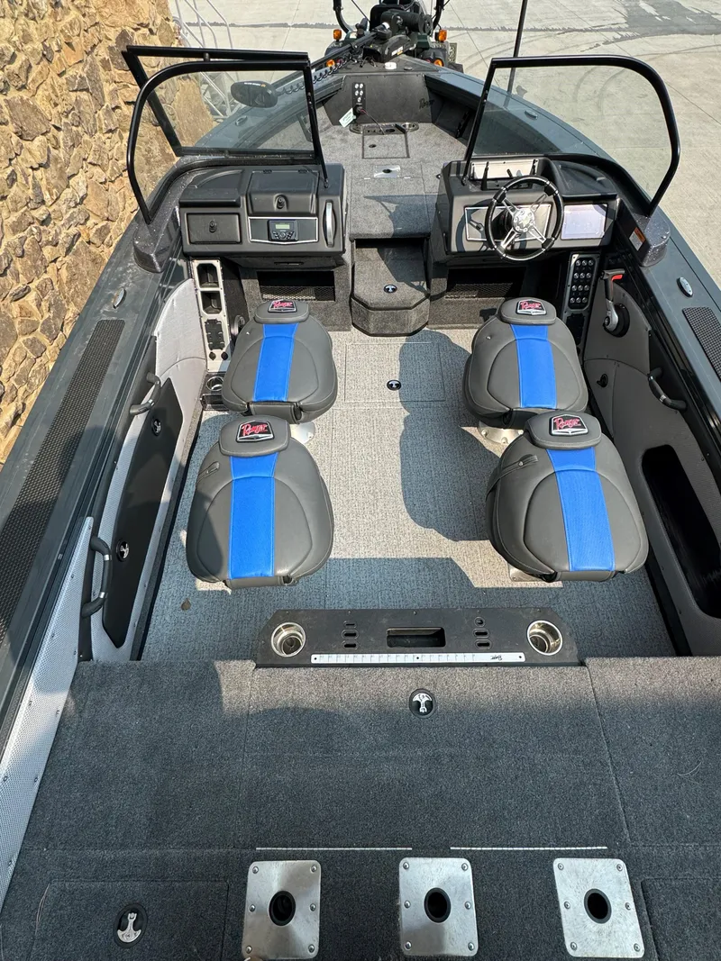 Slide: The Image of 2024 Ranger VX1788 WT boat interior with seating and steering console. - 2