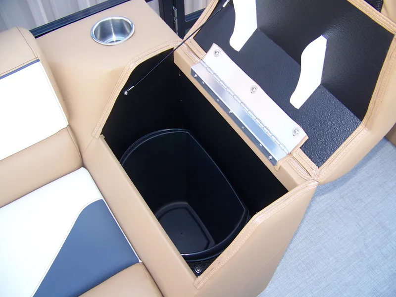 Slide: The Image of Open storage compartment in 2025 Avalon Ven25VRB boat with cup holder. - 10
