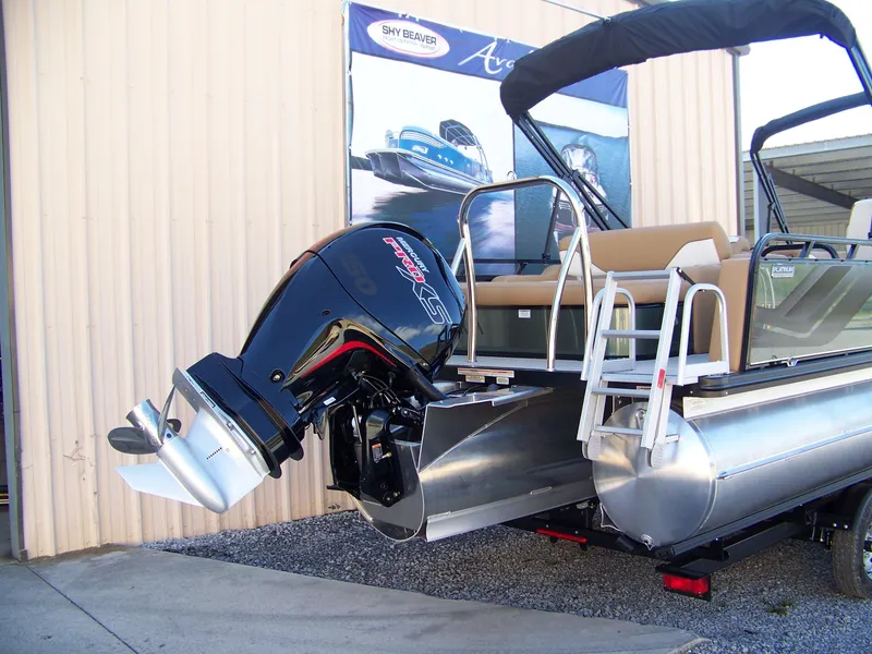 Slide: The Image of 2025 Avalon Ven25VRB pontoon boat with powerful outboard motor, displayed outdoors. - 3
