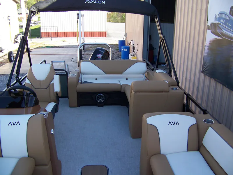 Slide: The Image of 2025 Avalon Ven25VRB pontoon boat interior with tan and white seating. - 5