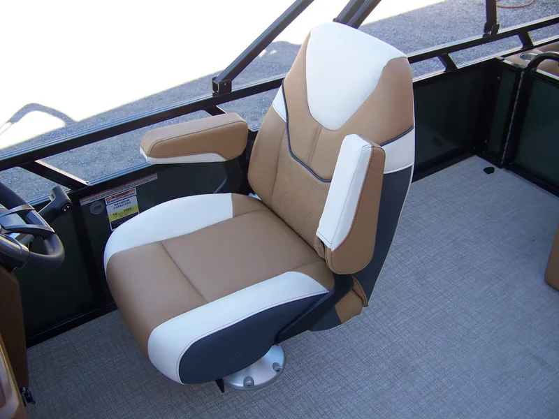 Slide: The Image of Captain's chair in 2025 Avalon Ven25VRB boat, featuring tan and white upholstery. - 9