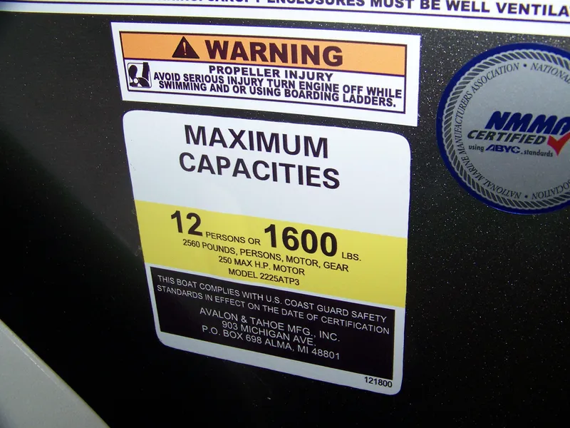 Slide: The Image of Warning label on Avalon LSZ23QLS 2025 boat showing maximum capacity and safety instructions. - 11