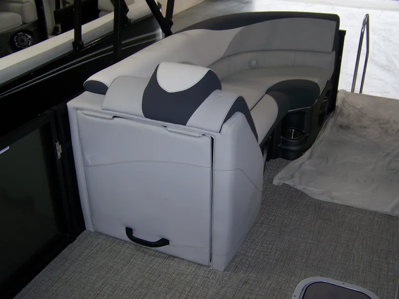 Slide: The Image of 2025 Avalon LSZ23QLS boat interior with gray seating and carpeted flooring. - 12