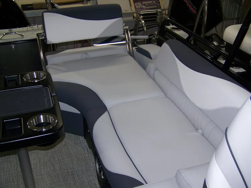 Slide: The Image of Luxurious seating on 2025 Avalon LSZ23QLS boat with cup holders and sleek design. - 13