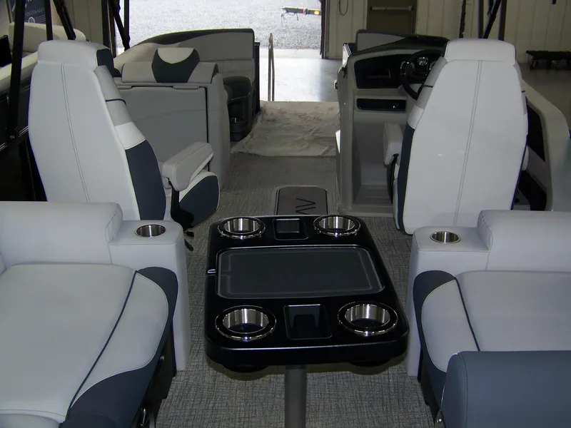 Slide: The Image of Luxurious interior of 2025 Avalon LSZ23QLS pontoon boat with plush seating and cup holders. - 15