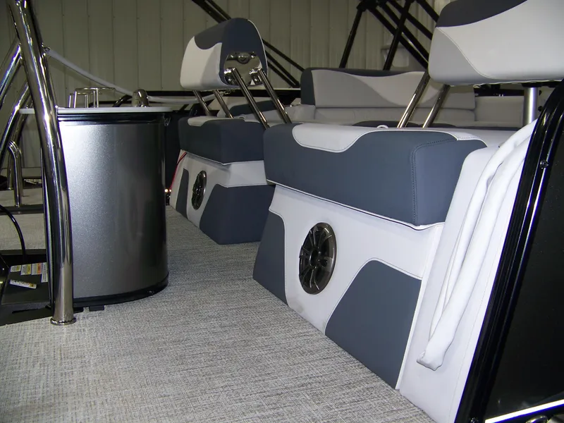 Slide: The Image of 2025 Avalon LSZ23QLS boat interior with modern seating and speaker system. - 5