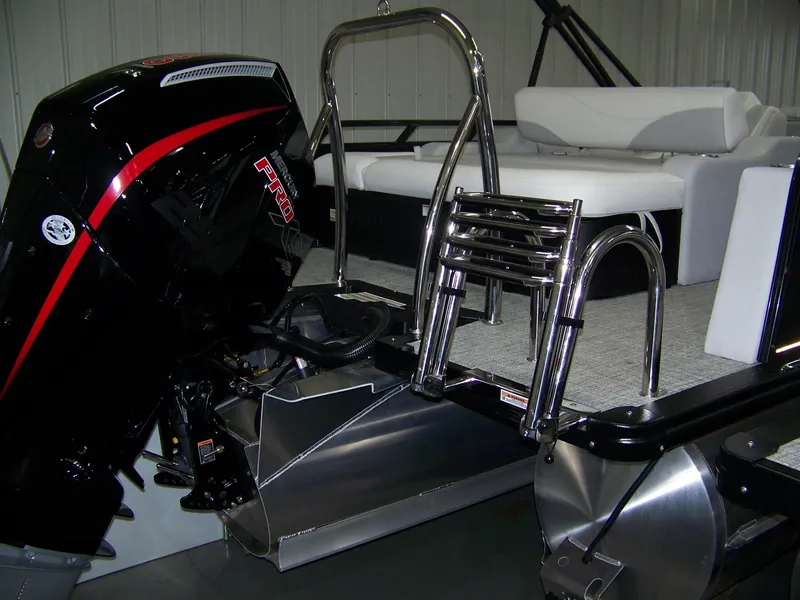 Slide: The Image of 2025 Avalon LSZ25VRB pontoon boat with powerful outboard motor and sleek design. - 10