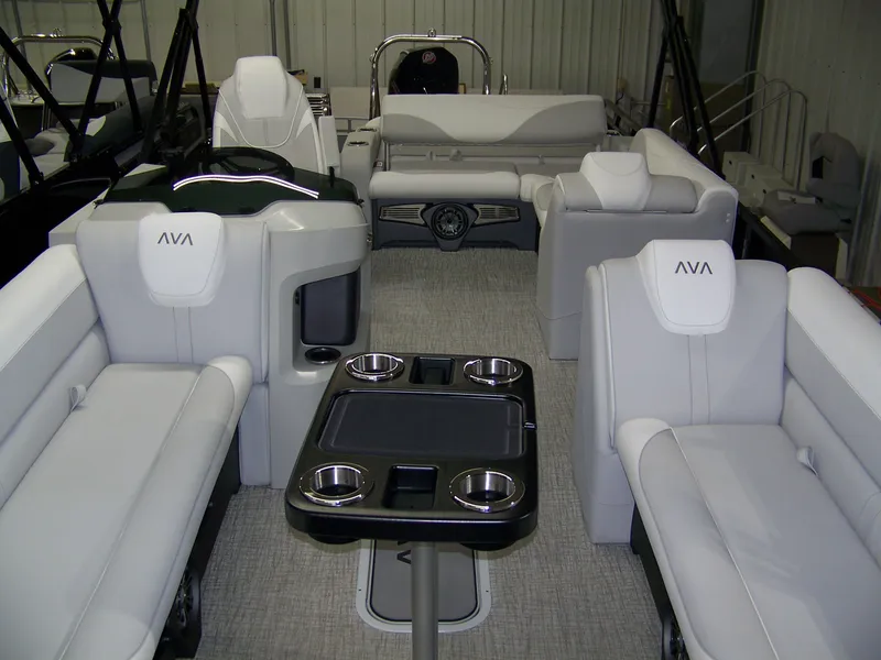 Slide: The Image of 2025 Avalon LSZ25VRB pontoon boat interior with luxurious seating and cup holders. - 3