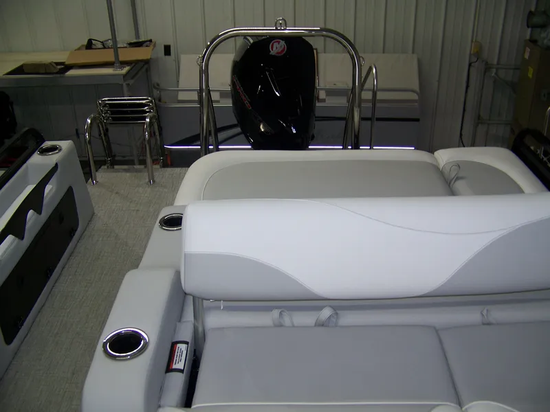 Slide: The Image of 2025 Avalon LSZ25VRB boat interior with gray seating and cup holders. - 8