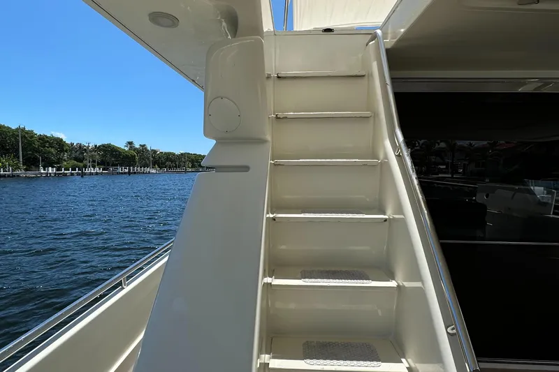 Slide: The Image of Staircase on 1998 Ferretti Yachts 80, overlooking serene waterfront. - 12